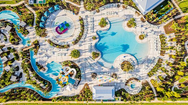 Top-down aerial of the lazy river winding around the main pool in Clermont