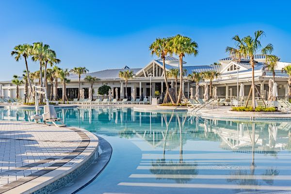 Zero-entry resort pool with the clubhouse behind in Clermont