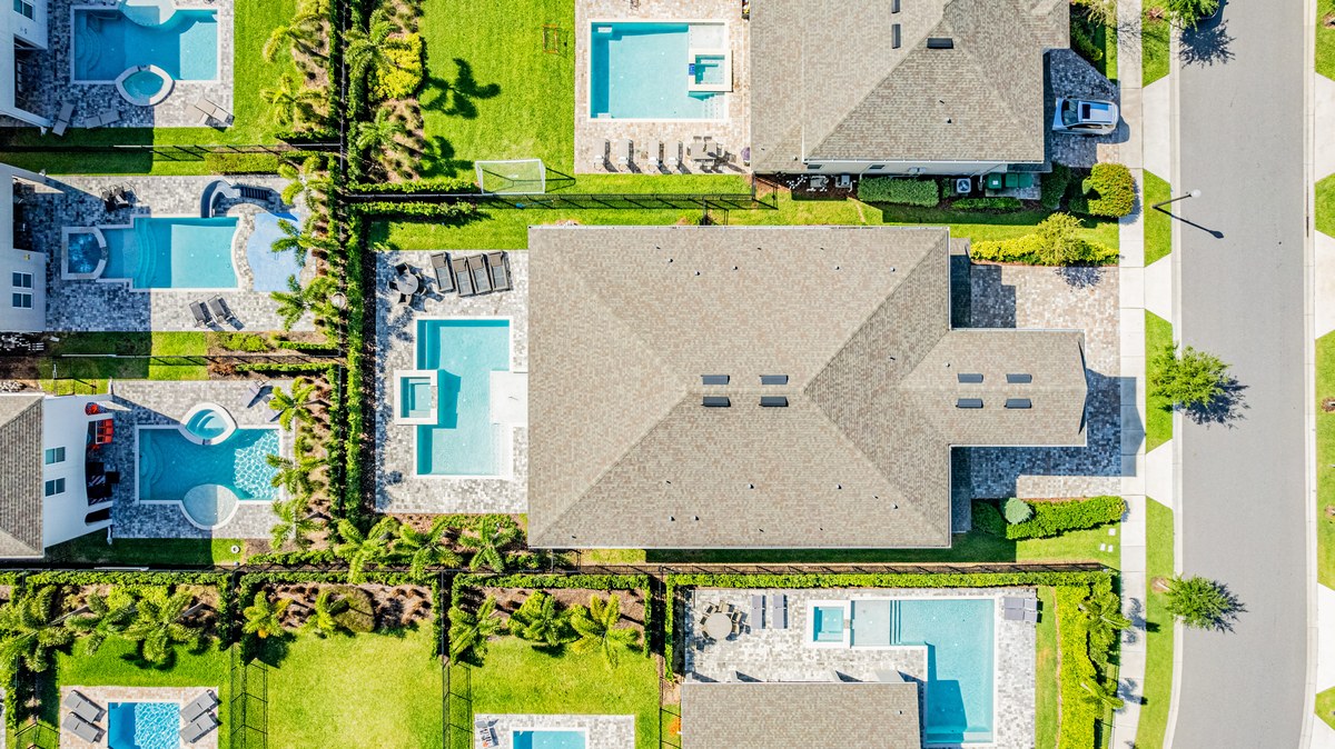 Top-down aerial of vacation homes with private screened pools in Kissimmee