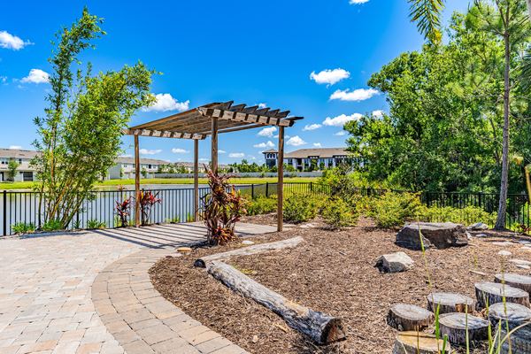 Pergola and landscaped garden beside the lake in Palmetto