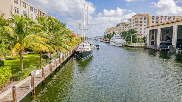 Aerial of a canal lined with sailboats and waterfront buildings in Fort Lauderdale