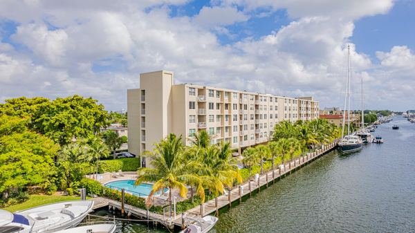 Aerial of a waterfront condominium building along the same canal in Fort Lauderdale