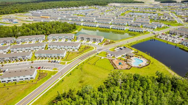 Aerial of a large residential community beside a highway in Poinciana