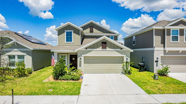Elevated view of a home with a US flag beside the garage in Davenport