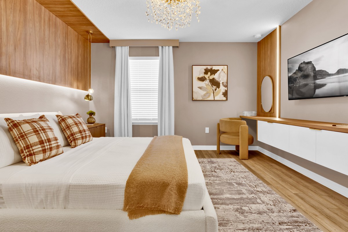 Bedroom with a wood ceiling and framed art in Davenport