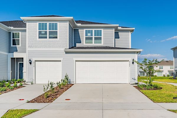 Gray paired townhome photographed straight on in Kissimmee
