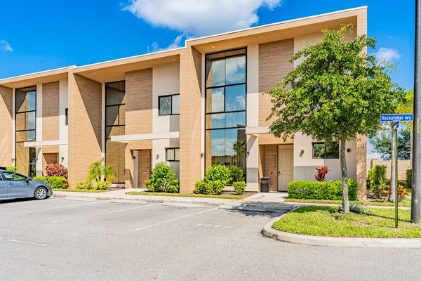 Modern townhome row from the same development with full-height glazing in Kissimmee