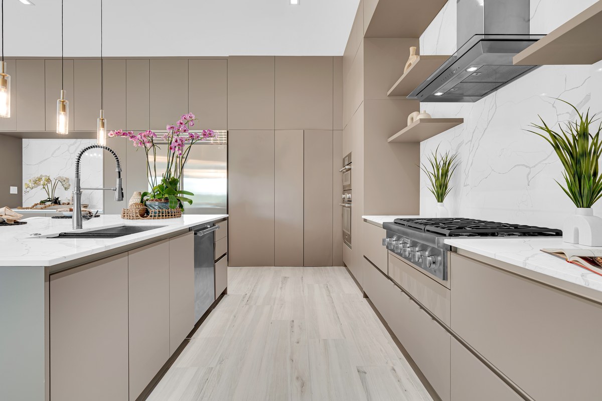 Modern taupe kitchen with orchids on the island in Windermere