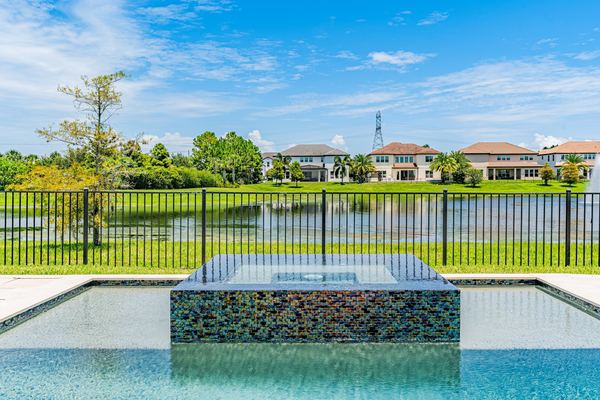 The pool and glass-tile spa overlooking the lake in Windermere