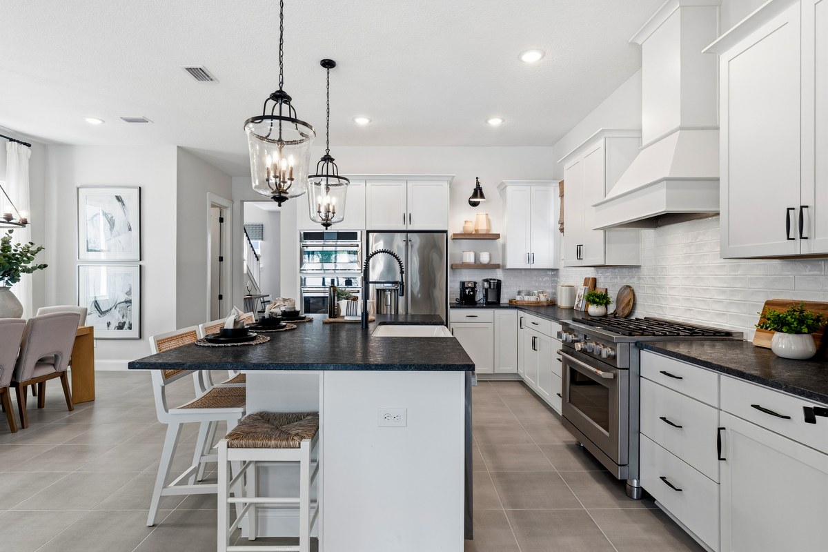 Kitchen with dark counters and a gas range in Winter Garden