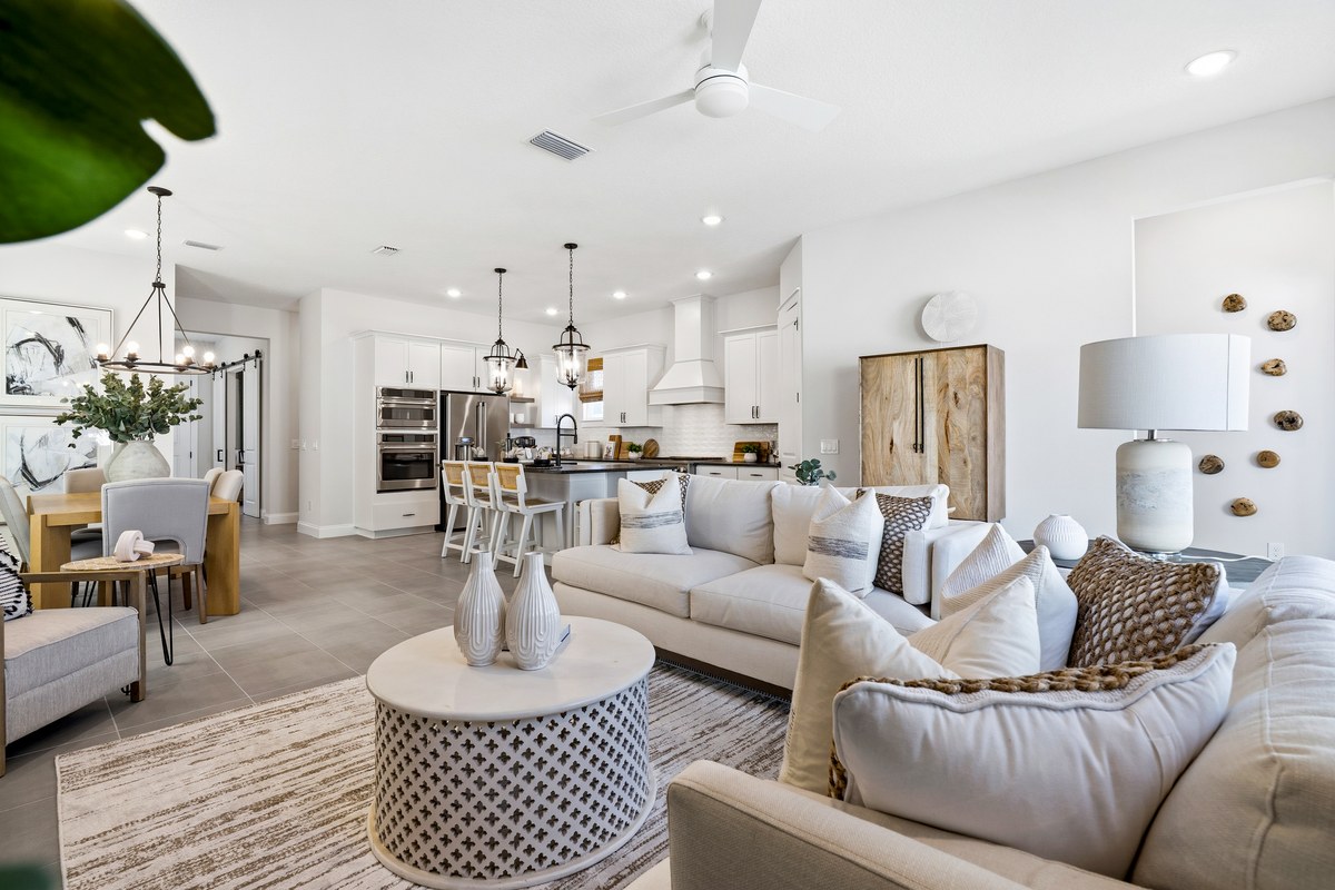 Living room with a cream sectional and a round coffee table in Winter Garden