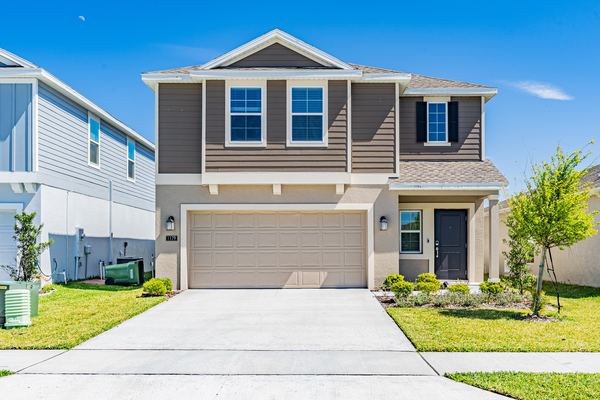 Gray two-story home with an attached garage in Winter Haven
