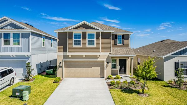 Elevated view of a two-story home with an attached garage in Winter Haven
